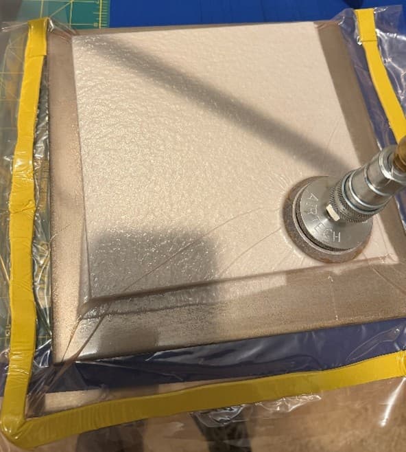 Vacuum bagged repair assembly with caul plate over the repair stack